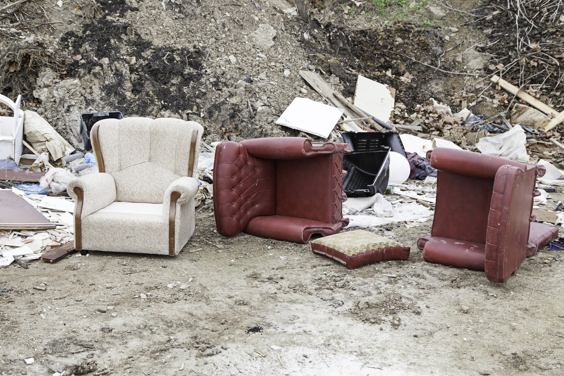 Sofa chairs and other rubbish broken and abandoned.