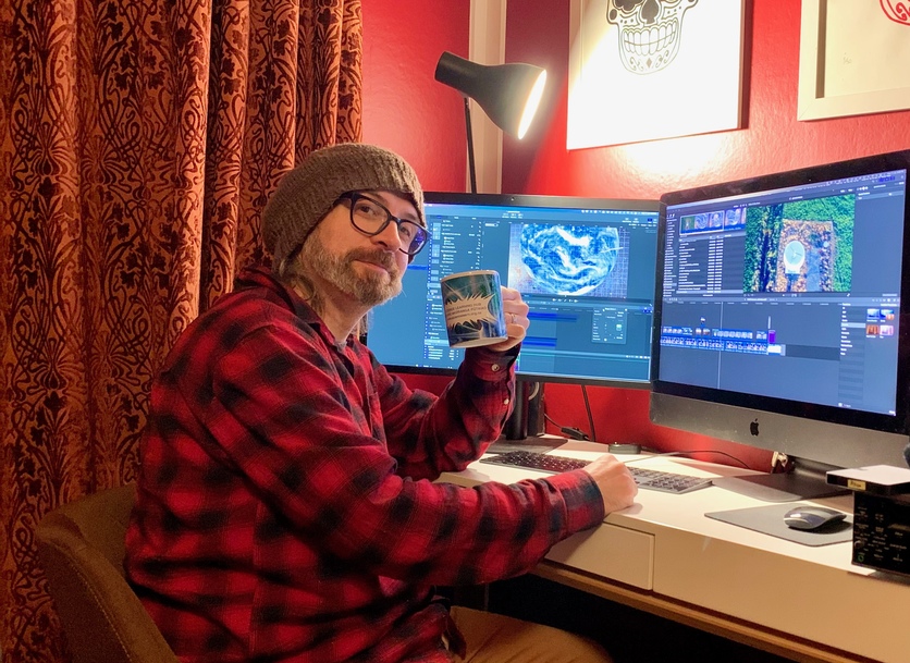Image of Tom Goulter working on the space video clips. 