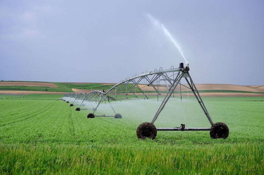 Spray irrigators watering farm land. 