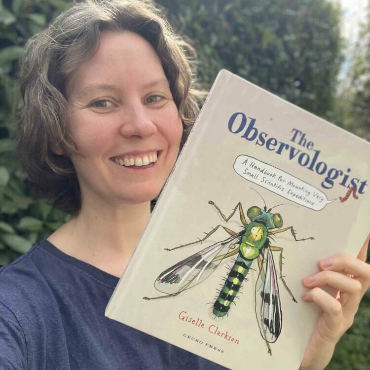 Giselle Clarkson holding her book The Observologist 
