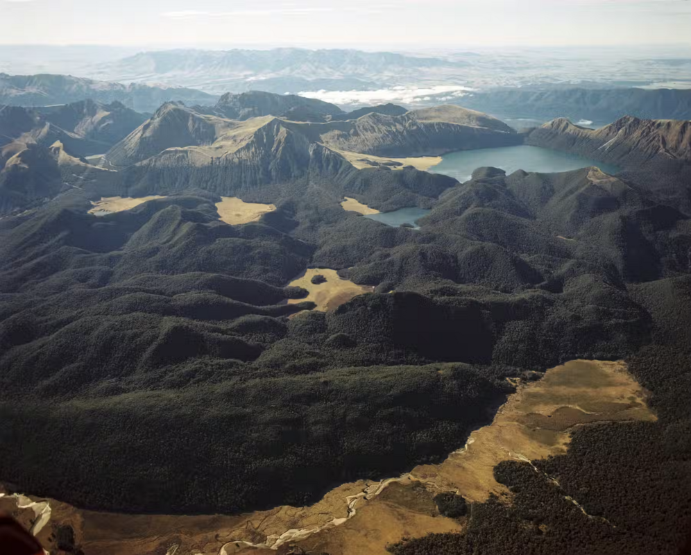 Aerial view of NZ's Green Lake and mountainous landscape