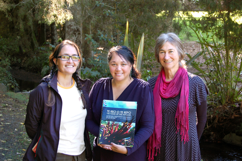 3 women holding book Te Reo o Te Repo – The Voice of the Wetland